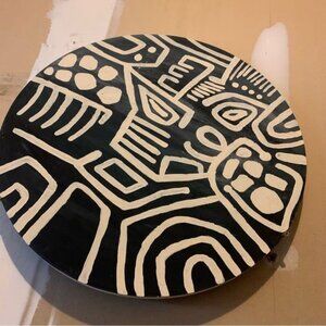 Modern minimalist wall art on round wooden panel